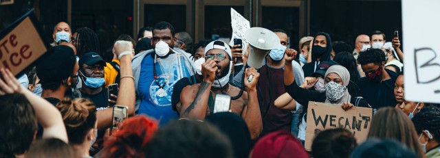 crowd-of-protesters-holding-signs-4508668.jpg