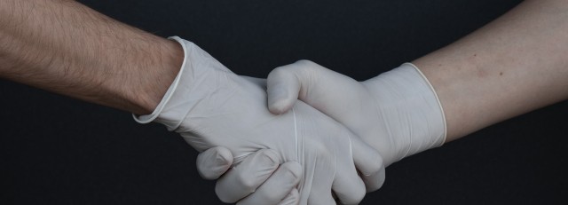people-shaking-hands-in-latex-gloves-3959482.jpg